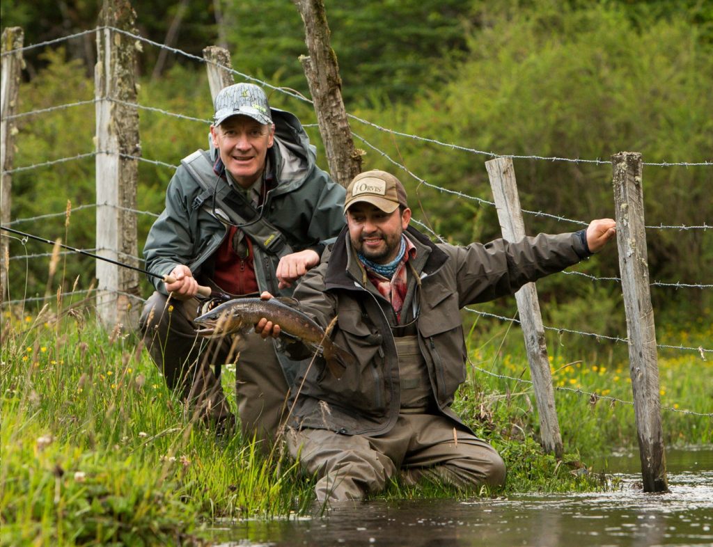 Orvis team and guides with a brown trout